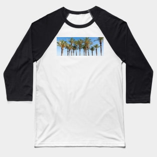 Row of tropical feeling palm trees against blue sky with luch green fronds. Baseball T-Shirt